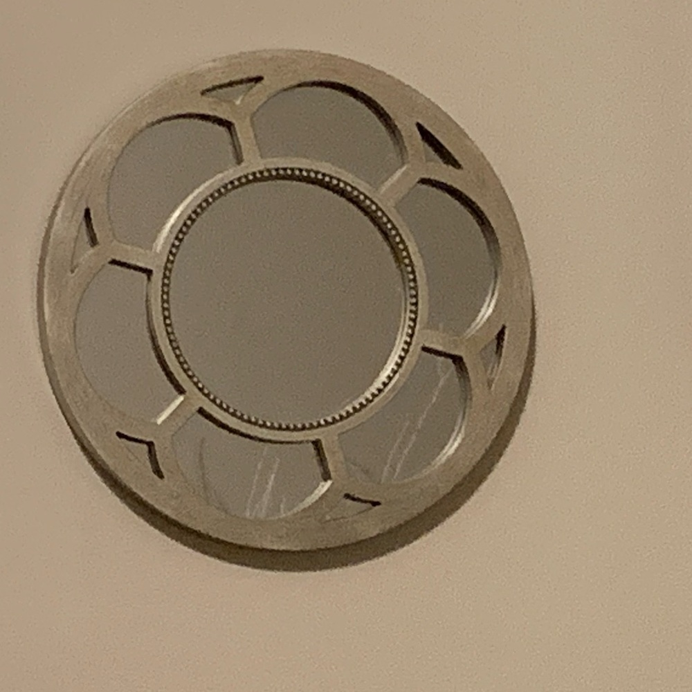 Three silver small circular mirrors. Perfect for a little girl’s room.